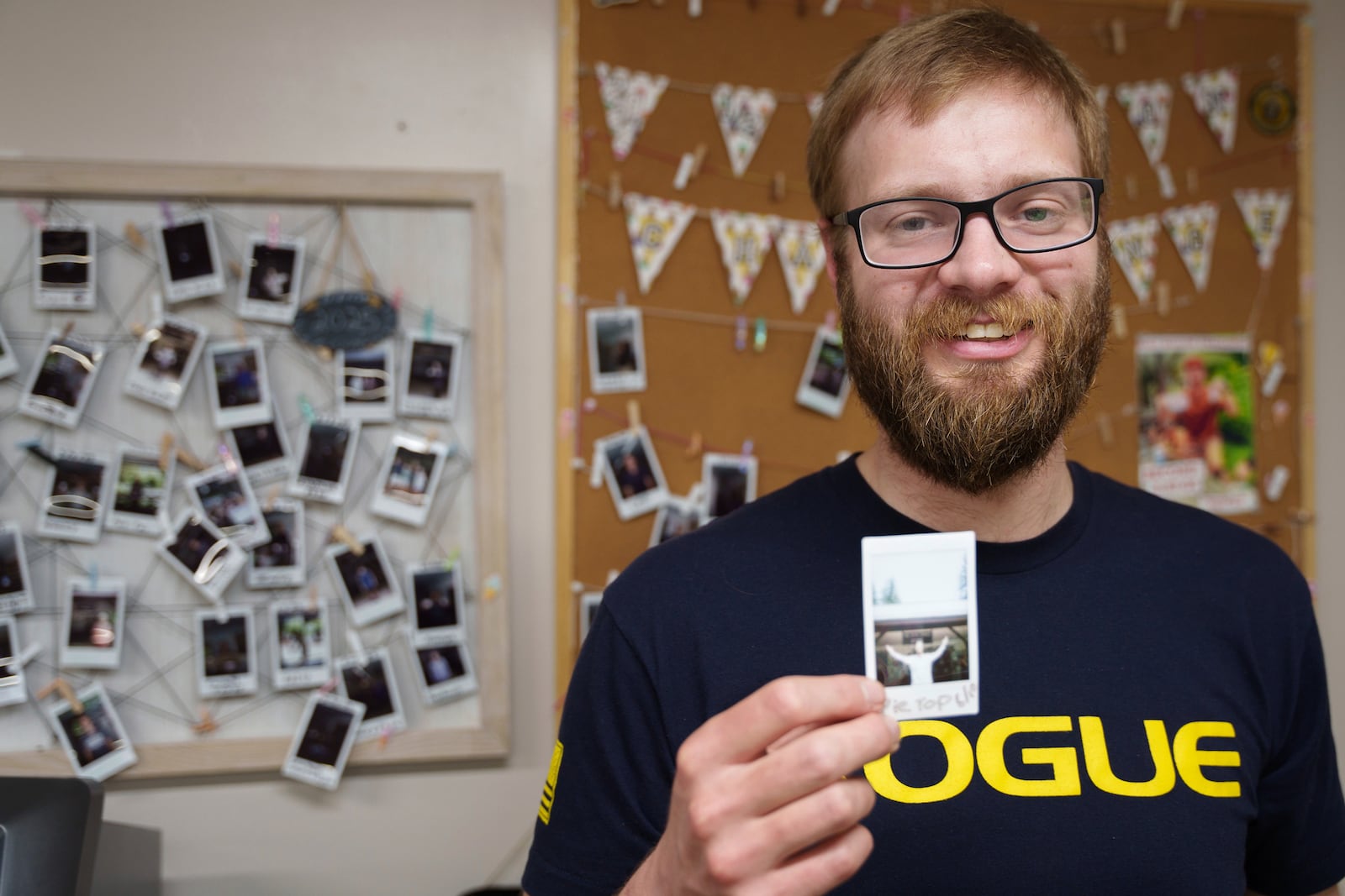 Appalachian Trail thru-hiker Sam Cooper, trail name Pie Top, poses for a photo after completing the half-gallon ice cream challenge at Pine Grove Furnace State Park in Pennsylvania on Tuesday, June 10, 2025. (AP Photo/Mingson Lau)