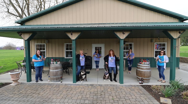 Workers at the Brandeberry Winery in Enon practice social distancing while preparing orders of wine. CONTRIBUTED PHOTO