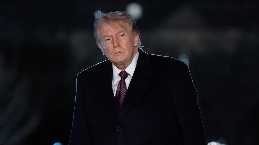 President Donald Trump walks on the South Lawn upon his arrival to the White House, Sunday, March 15, 2026, in Washington. (AP Photo/Jose Luis Magana)