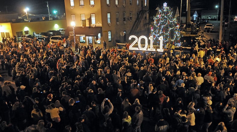 Scenes from past New Carlisle New Year’s Eve Ball Drop events. MARSHALL GORBY / STAFF FILE PHOTO
