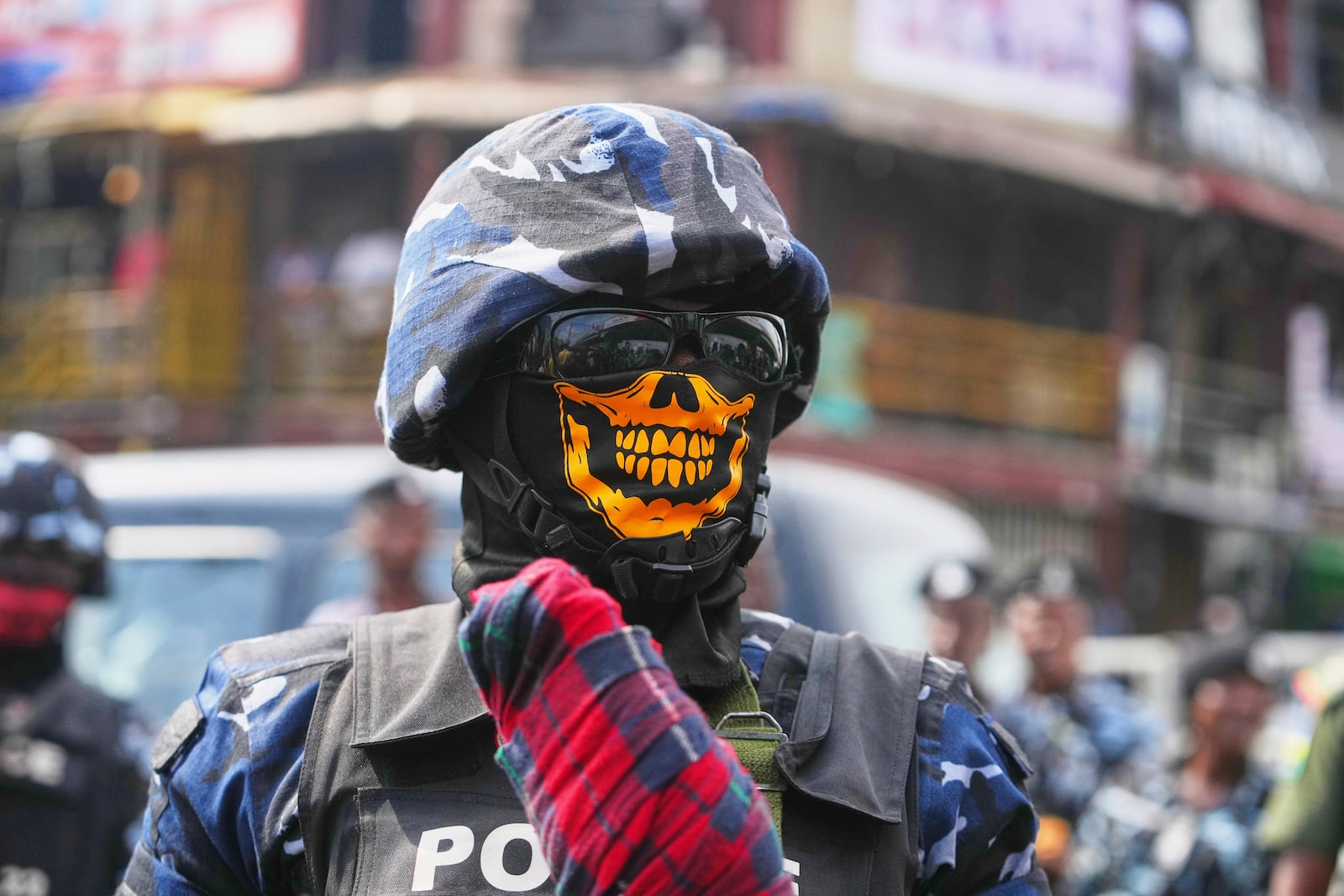 A police officer guards during anti-government protests on streets of Lagos, Nigeria, Thursday, June 12, 2025. (AP Photo/Sunday Alamba)