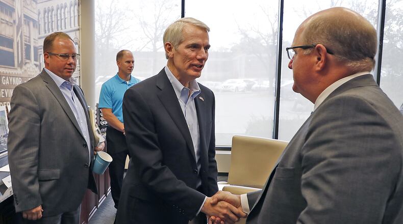 U.S. Sen. Rob Portman, center, meets with the Chamber of Greater Springfield on Monday to discuss the issue of tax reform. Bill Lackey/Staff