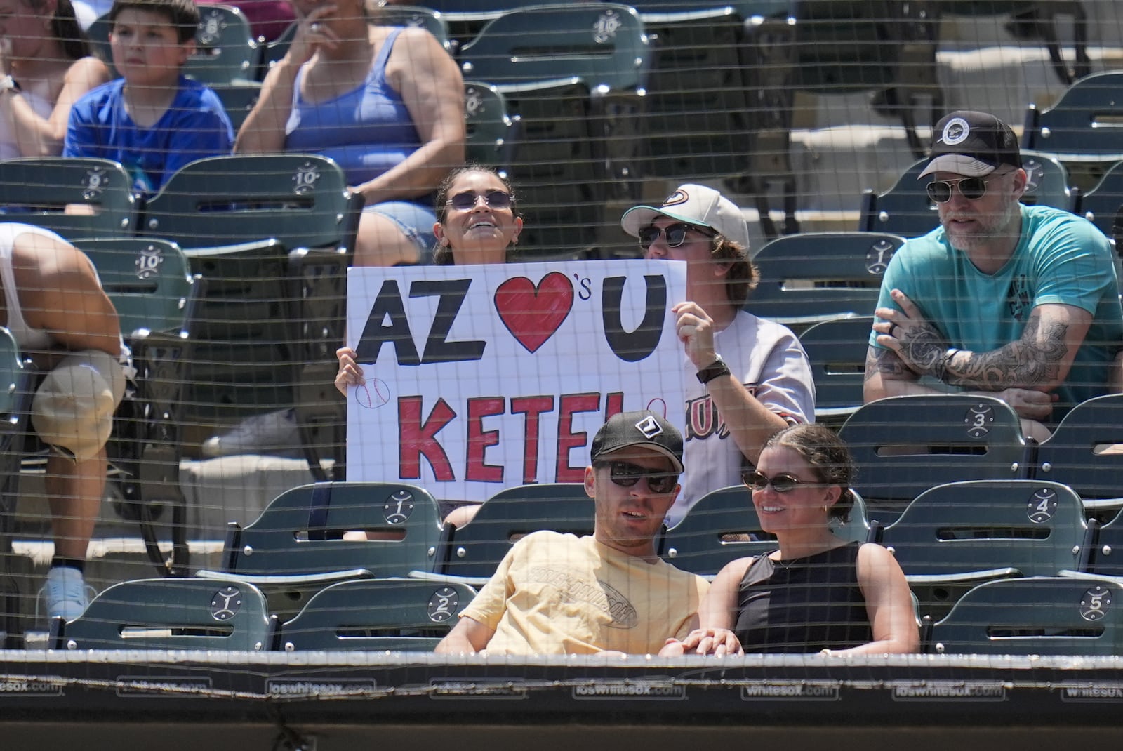 Fans show support for Arizona Diamondbacks' Ketel Marte (4) during the third inning of a baseball game against the Chicago White Sox, Wednesday, June 25, 2025, in Chicago. (AP Photo/Erin Hooley)