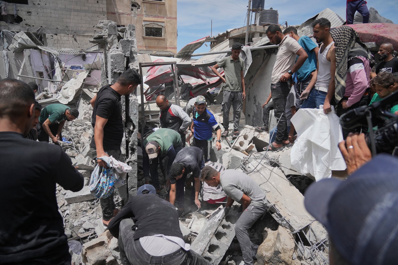Palestinians search the rubble of a house targeted by an Israeli army strike that killed at least five people in Khan Younis, in the southern Gaza Strip, on Thursday, May 1, 2025. (AP Photo/Abdel Kareem Hana)