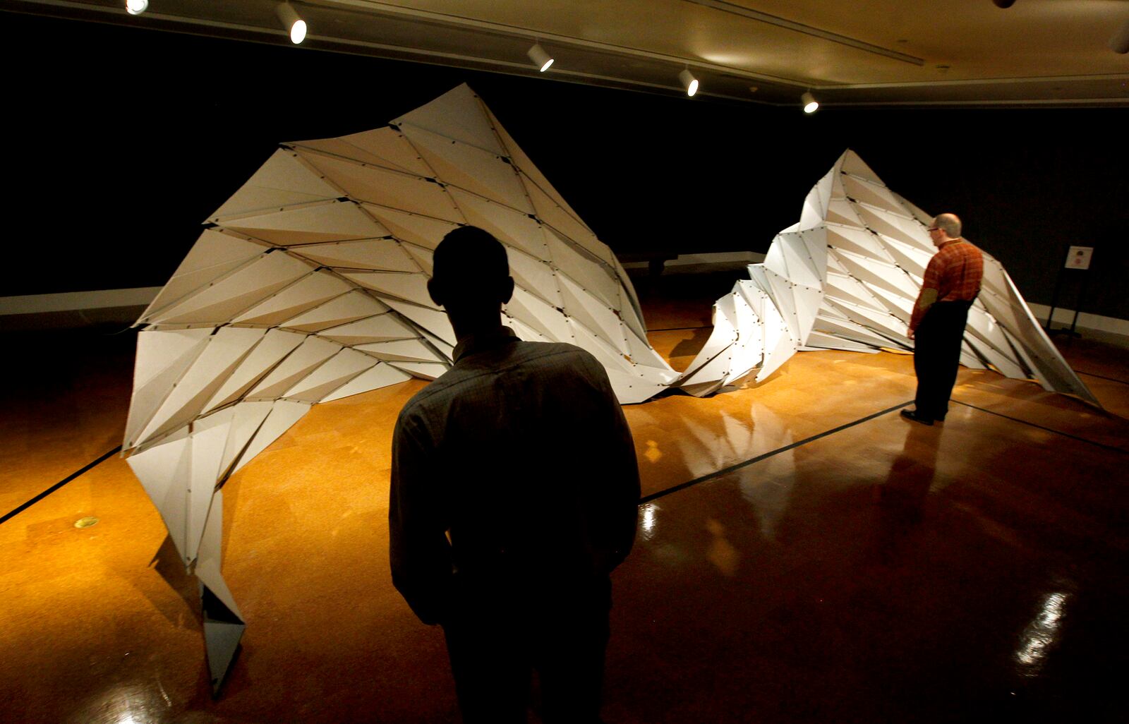 "Ruga Swan," by artist Jiangmei Wu, is one of the pieces in the Dayton Art Institute origami exhibit, Above the Fold: New Expressions in Origami. LISA POWELL / STAFF