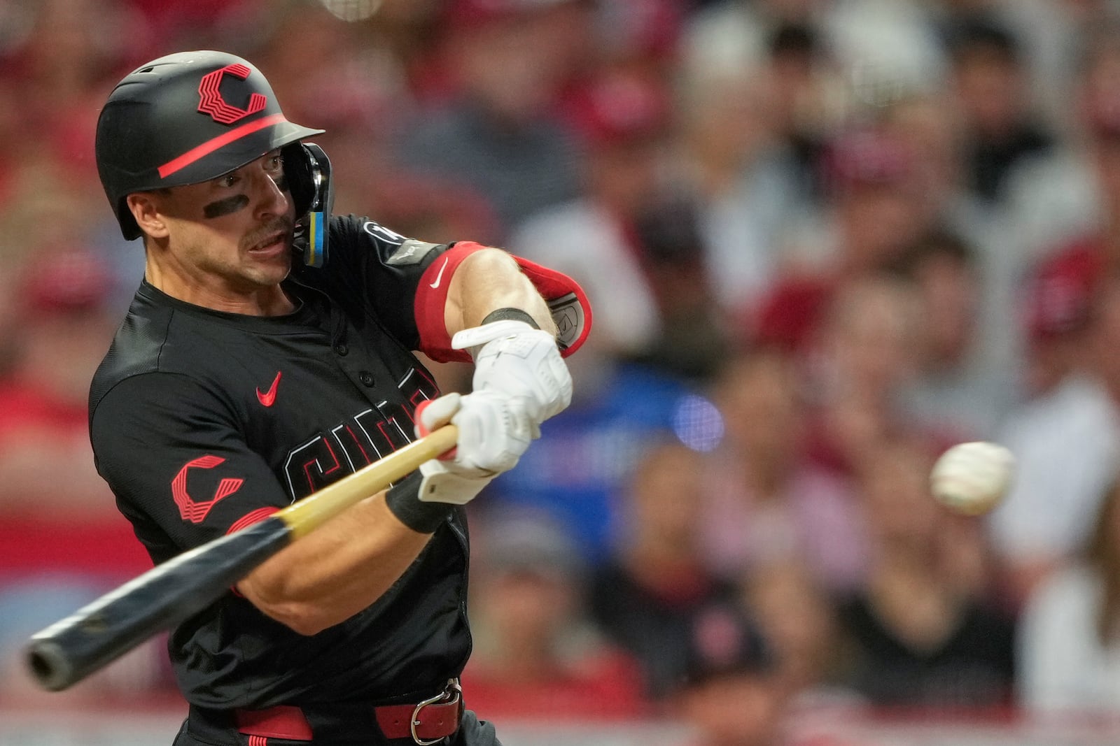 Cincinnati Reds' Spencer Steer hits a solo home run during the sixth inning of a baseball game against the St. Louis Cardinals Friday, Aug. 29, 2025, in Cincinnati. (AP Photo/Carolyn Kaster)