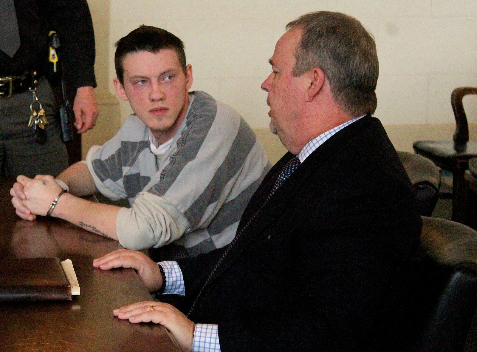 Kenneth Sammons and his attorney Shawn Murphy talk after Sammons was sentenced to five years in prison. JEFF GUERINI/STAFF