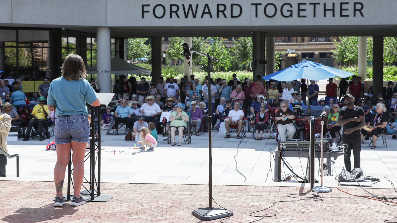 Hundreds of people turned out on Saturday, Aug. 2, on City Hall Plaza in downtown Springfield for "Love Thy Neighbor," which was organized by Springfield G92, a coalition of churches that says it is "committed to the safety and dignity of our Haitian neighbors and friends." Over a dozen people spoke, and two choirs performed. The organization said the goal of the event was to "project love, unity and suport for our immigrant neighbors and community." BRYANT BILLING / STAFF