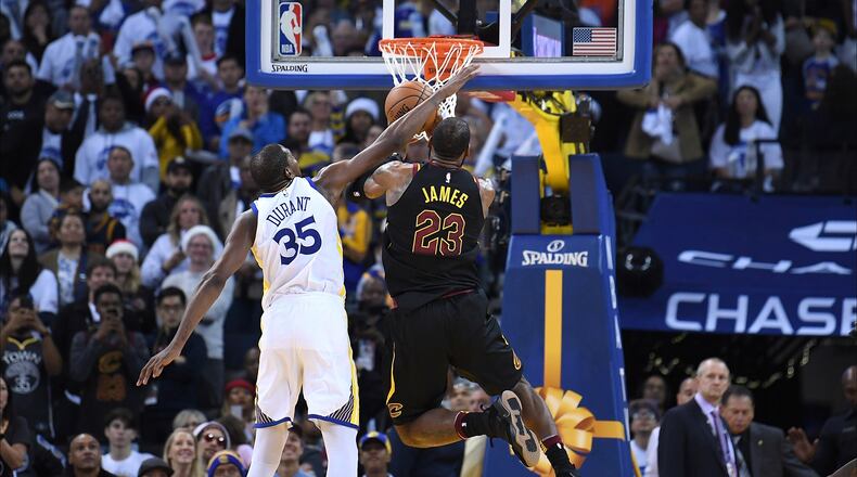OAKLAND, CA - DECEMBER 25: Kevin Durant #35 of the Golden State Warriors blocks the shot of LeBron James #23 of the Cleveland Cavaliers late in the fouth quarter of an NBA basketball game at ORACLE Arena on December 25, 2017 in Oakland, California. NOTE TO USER: User expressly acknowledges and agrees that, by downloading and or using this photograph, User is consenting to the terms and conditions of the Getty Images License Agreement. (Photo by Thearon W. Henderson/Getty Images)