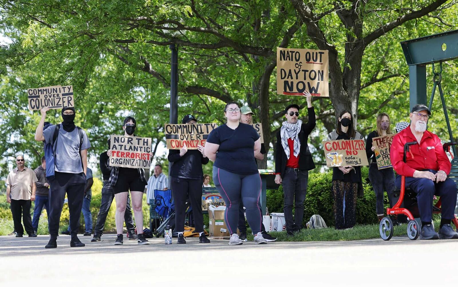 Protestors gathered at Deeds Point in Dayton across the Great Miami River from the security zone of the NATO Parliamentary Assembly on Saturday, May 24, 2025. NICK GRAHAM / STAFF