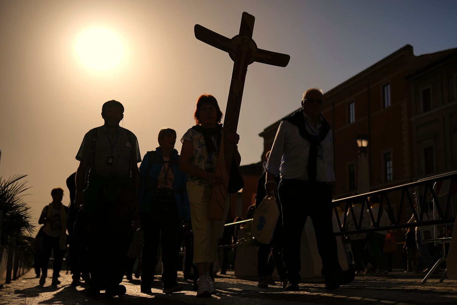 Pilgrims arrive in St. Peter's Square at the Vatican, Tuesday, April 22, 2025. (AP Photo/Francisco Seco)
