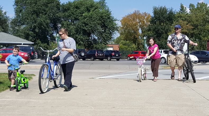 A family embarks on the Simon Kenton Bike Path that cuts through Champaign County. A group of volunteers that maintain the trail will hold a bike tour on Sunday, Sept. 8, with the hopes of raising money to maintain the trail. CONTRIBUTED
