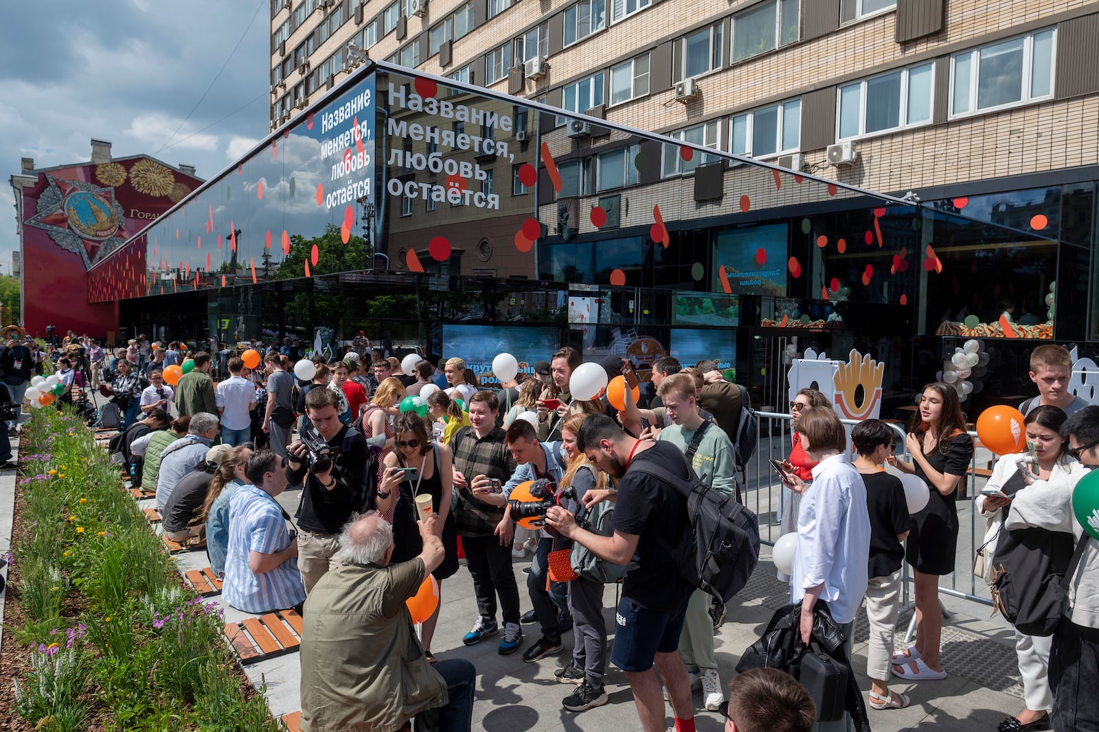 FILE - People line up to visit a newly opened fast food restaurant in a former McDonald's outlet in Bolshaya Bronnaya Street in Moscow, Russia, Sunday, June 12, 2022. The sign reads "The Name Changes, Love Remains." (AP Photo/Dmitry Serebryakov, File)