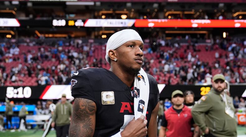 Atlanta Falcons quarterback Michael Penix Jr. (9) walks of the field after overtime of an NFL football game against the Carolina Panthers, Sunday, Nov. 16, 2025, in Atlanta. (AP Photo/Brynn Anderson)