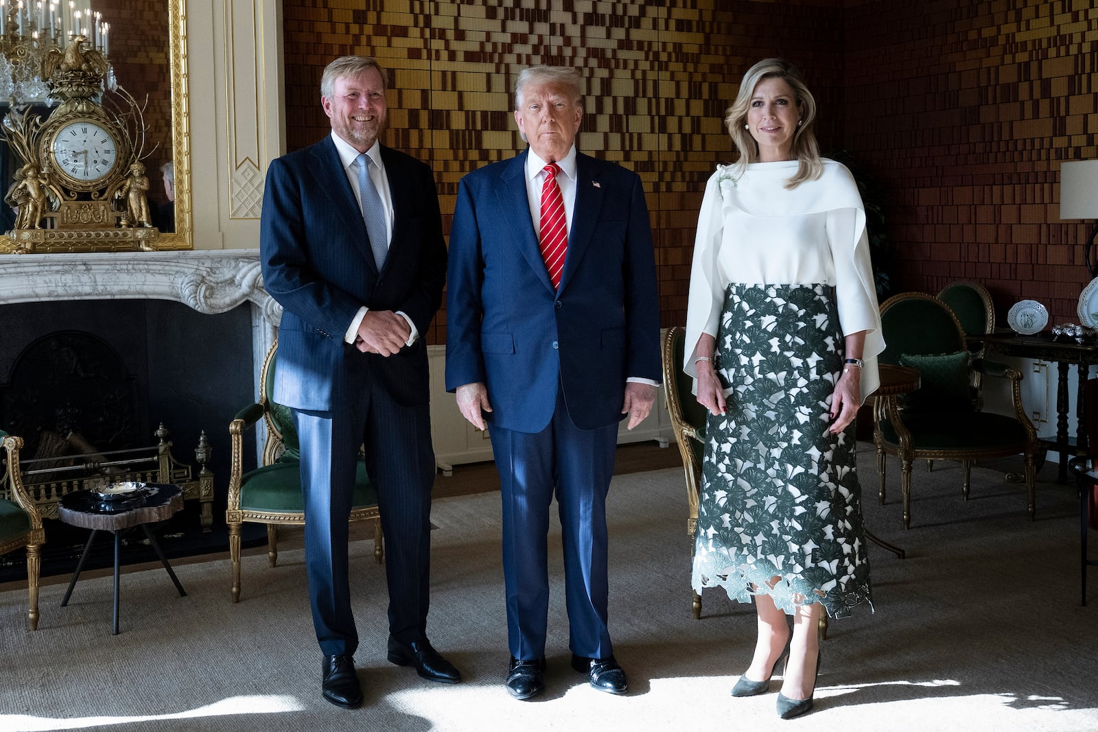 President Donald Trump poses with Netherlands' King Willem Alexander, left, and Netherlands' Queen Maxima at the Paleis Huis den Bosch prior to attending a NATO summit, in The Hague, Netherlands, Wednesday, June 25, 2025. (Brendan Smialowski/Pool Photo via AP)