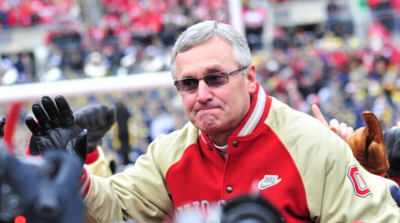 Tressel being hoisted into the air by members of his 2002 National Championship team.