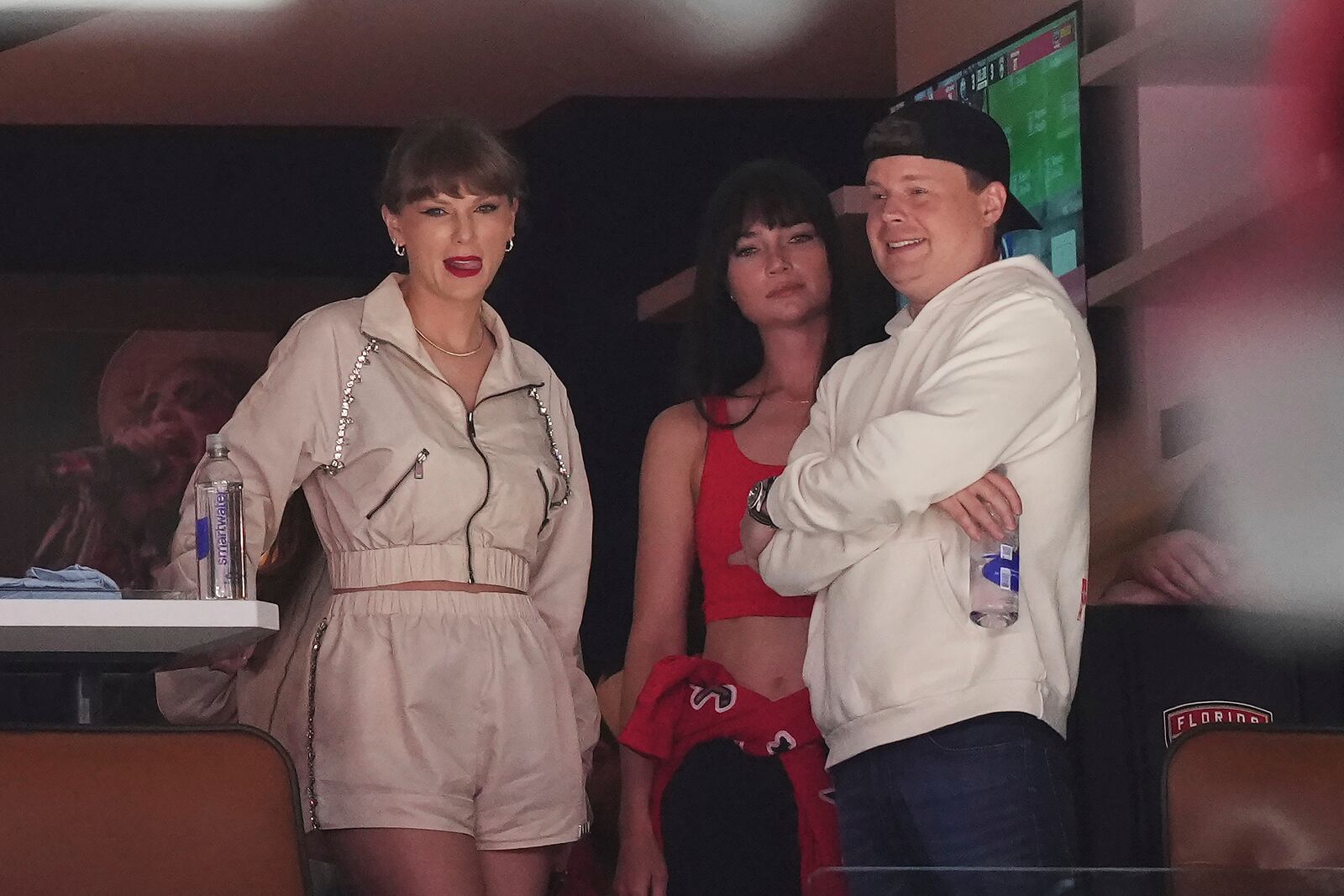 Singer Taylor Swift, left, takes in the third period in Game 4 of the NHL hockey Stanley Cup Final between the Edmonton Oilers and the Florida Panthers in Sunrise, Fla., Thursday, June 12, 2025. (Nathan Denette/The Canadian Press via AP)