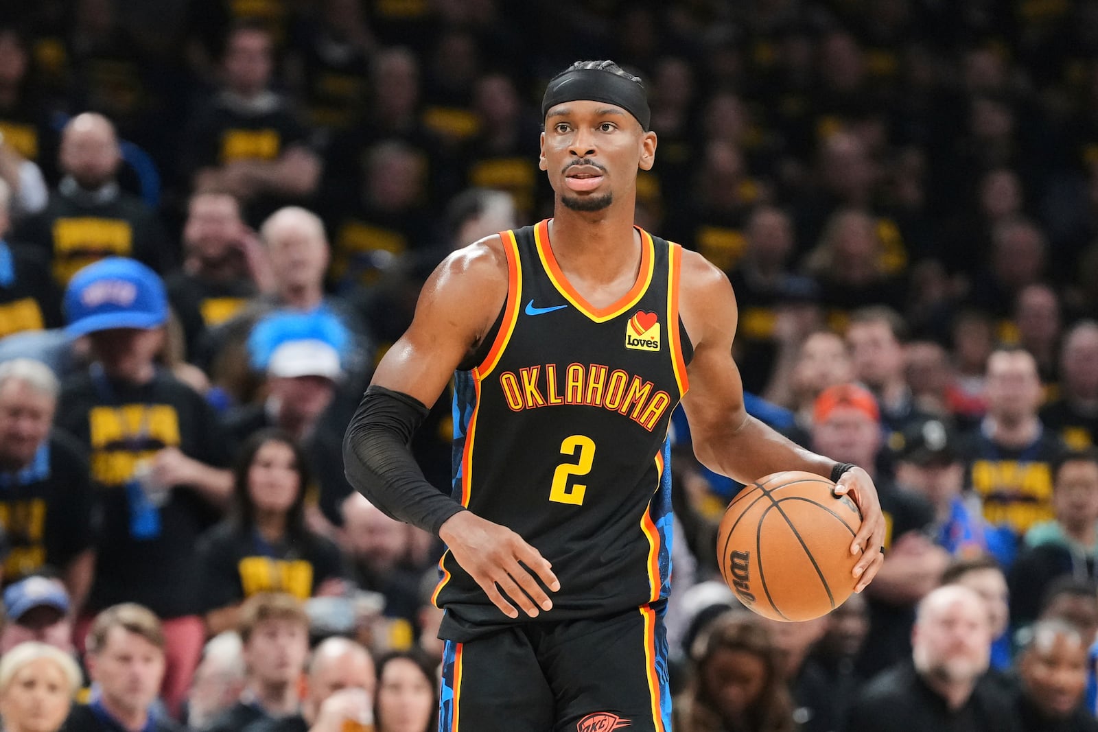Oklahoma City Thunder guard Shai Gilgeous-Alexander (2) handles the ball as he works against the Denver Nuggets in the second half of Game 2 in the conference semifinals of the NBA basketball playoffs, Wednesday, May 7, 2025, in Oklahoma City. (AP Photo/Kyle Phillips)