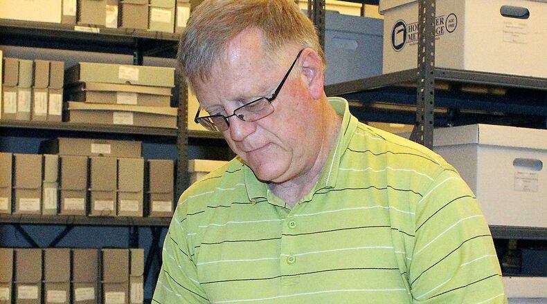 Roger Sherrock, CEO of the Clark County Historical Society looks thru some of the archives that the society houses. JEFF GUERINI/STAFF