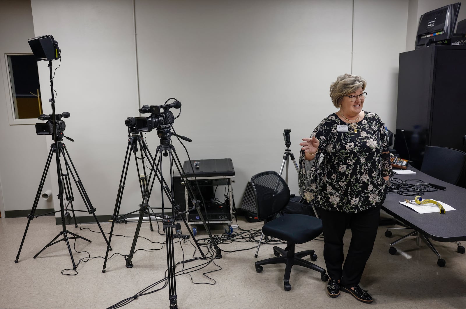 Tammy Leiker, human resources administrative assistant at Springfield City Schools, explains the layout of the media room during a tour as part of "The Dome Experience" at the Dome on Wednesday, March 25, 2026, in Springfield. JOSEPH COOKE/STAFF