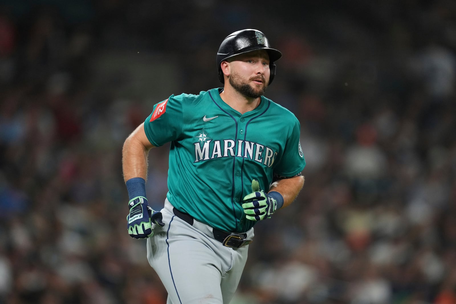 Seattle Mariners' Cal Raleigh rounds first base after hitting a grand slam against the Detroit Tigers in the ninth inning during a baseball game, Friday, July 11, 2025, in Detroit. (AP Photo/Paul Sancya)