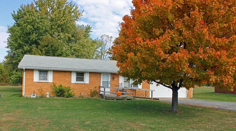 This ranch home with about 1,530 sq. ft. of living space has 2 bedrooms and a spacious family room addition. There is also an attached, 2-car garage. CONTRIBUTED PHOTO BY VICKIE KAPNAS