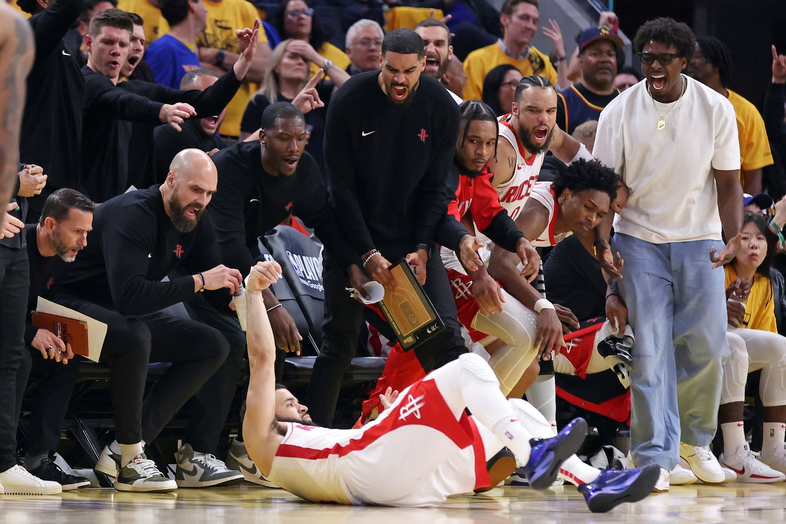 Houston Rockets' bench celebrates Fred VanVleet's three-pointer and a foul in fourth quarter of Game 6 of an NBA basketball first-round playoff series Friday, May 2, 2025, in San Francisco. (Scott Strazzante/San Francisco Chronicle via AP)