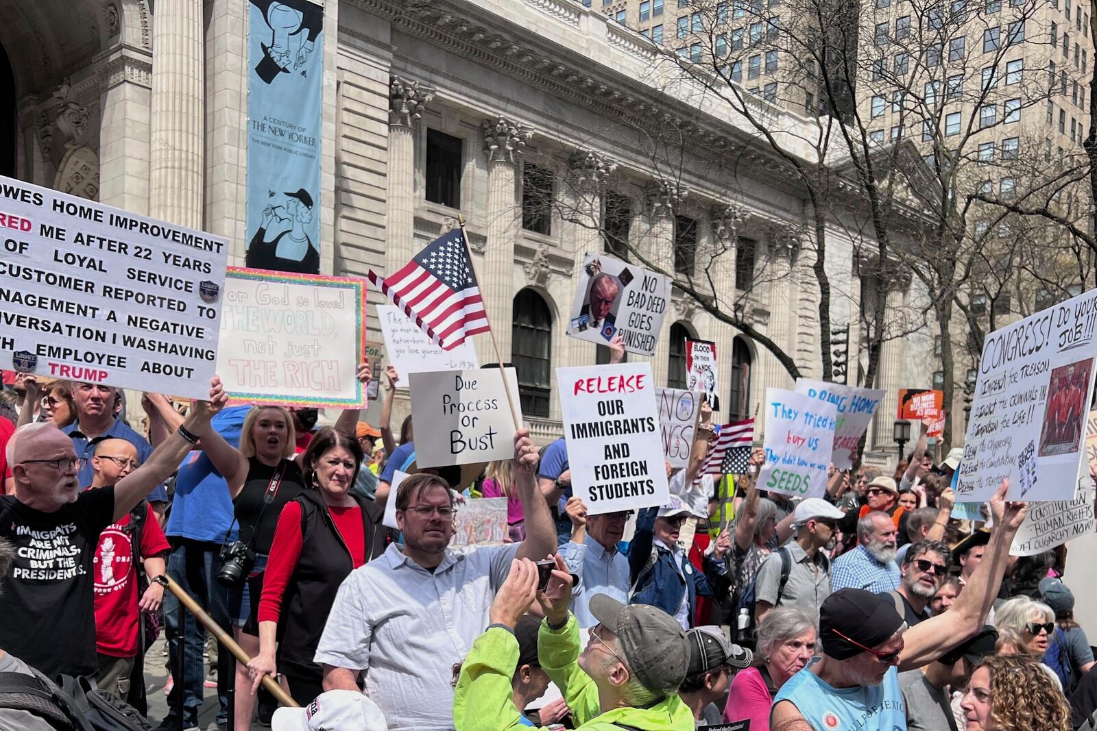 People gather to protest President Donald Trump's policies on Saturday, April 19, 2025 in New York. (AP Photo/Joseph Frederick)