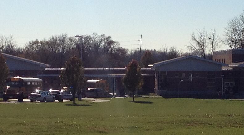 Kenwood Elementary in Springfield was placed on lockdown Thursday afternoon after a man brought an air pellet gun to the school building. That man and a man he passed the weapon to were arrested, police said.