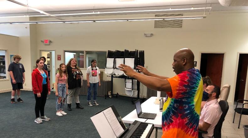 Music director Kent Brooks rehearses the cast and ensemble for the Youth Arts Ambassadors production of "Godspell, Jr." on Tuesday, July 6 and Wednesday, July 7 at Veterans Park as part of the Summer Arts Festival. Photo by Brett Turner