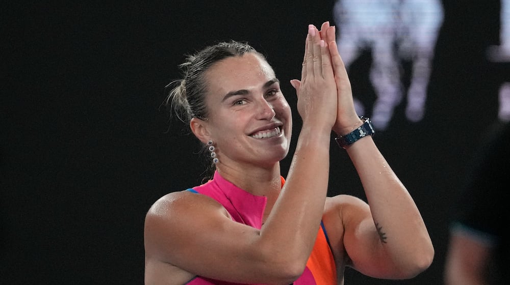 Aryna Sabalenka of Belarus celebrates after defeating Elina Svitolina of Ukraine in their semifinal match at the Australian Open tennis championship in Melbourne, Australia, Thursday, Jan. 29, 2026. (AP Photo/Dita Alangkara)