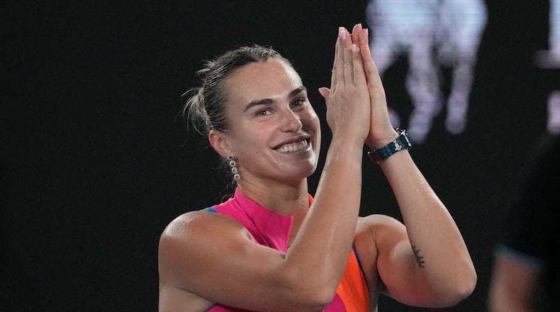 Aryna Sabalenka of Belarus celebrates after defeating Elina Svitolina of Ukraine in their semifinal match at the Australian Open tennis championship in Melbourne, Australia, Thursday, Jan. 29, 2026. (AP Photo/Dita Alangkara)