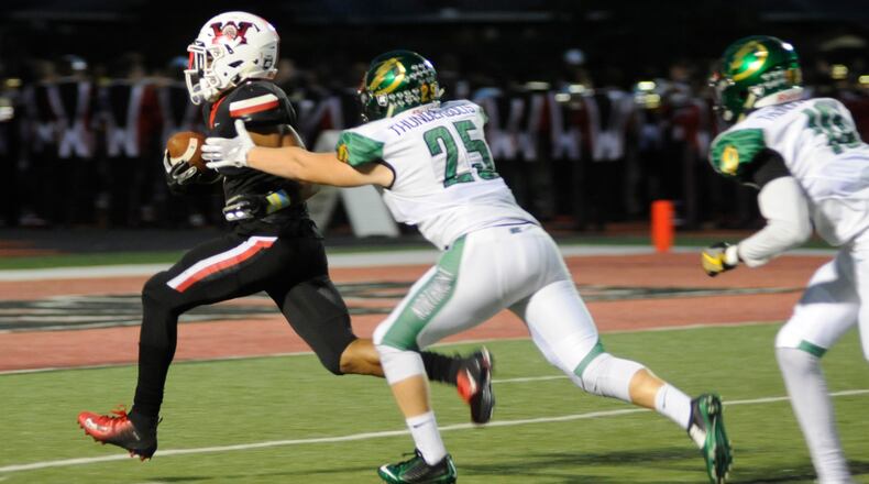 Wayne’s Steve Victoria (left) is pursued by Aidan Reaman of Northmont. Wayne defeated visiting Northmont 49-20 in a Week 5 high school football game on Friday, Sept. 21, 2018. MARC PENDLETON / STAFF