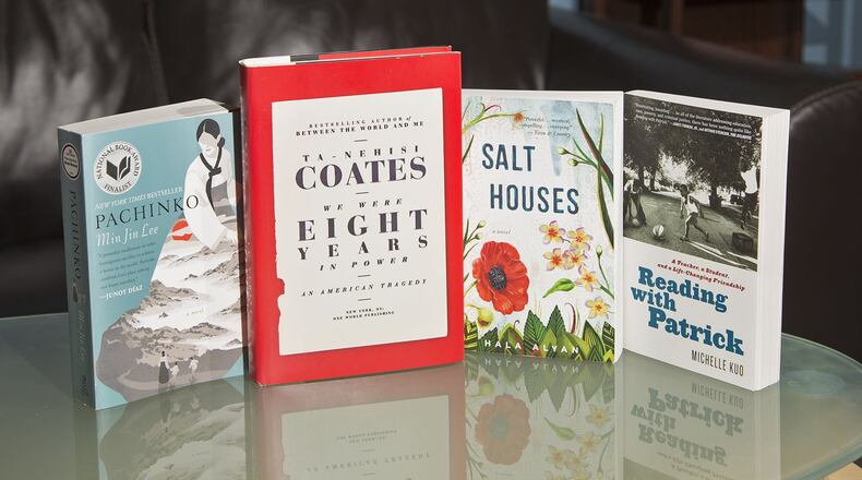 The books from Dayton Literary Peace Prize winners: “We Were Eight Years in Power” by Ta-Nehisi Coates, “Salt Houses” by Hala Alyan, and runners-up “Pachinko” by Min Jin Lee and “Reading with Patrick” by Michelle Kuo. TY GREENLEES / STAFF