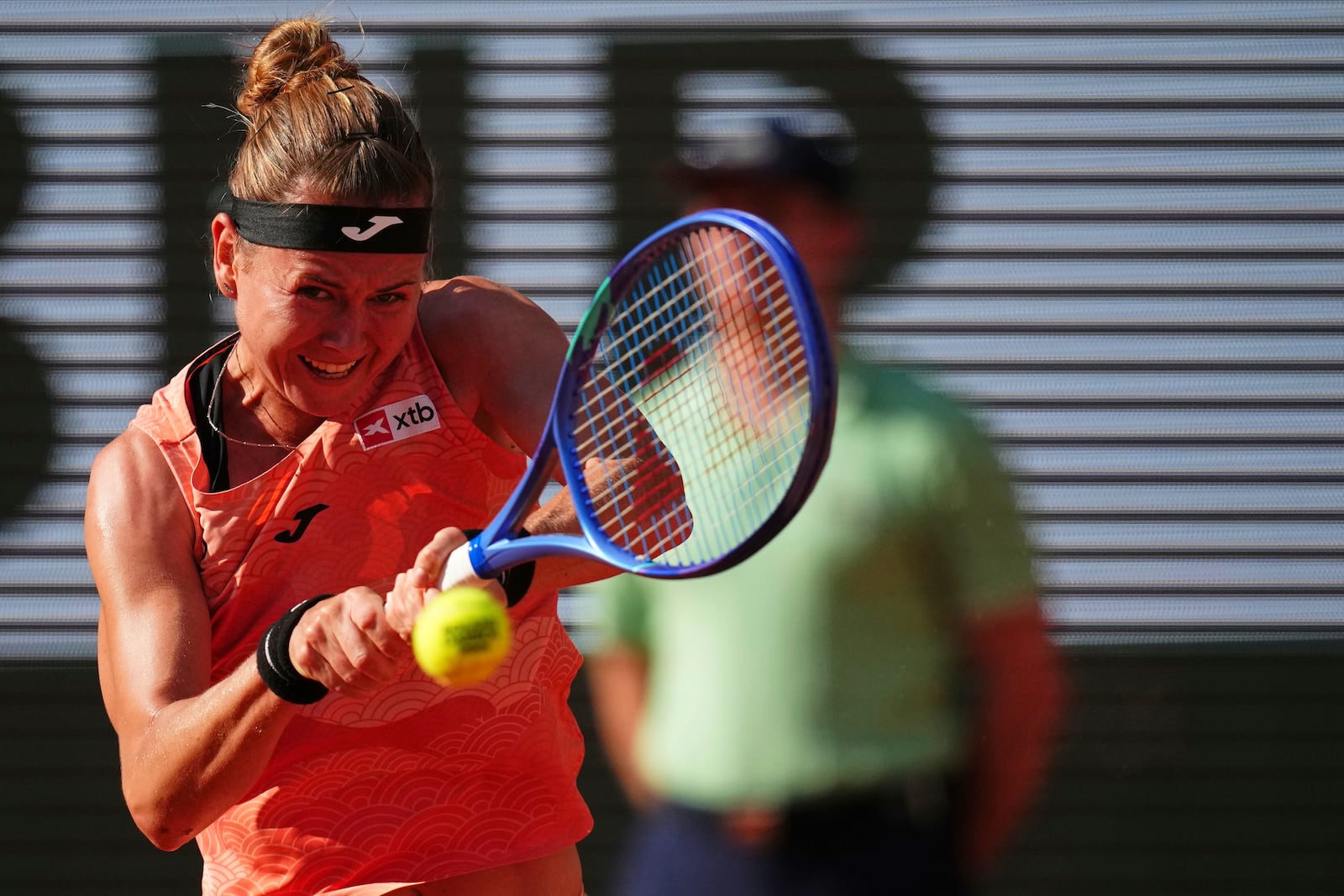Marie Bouzkova of the Czech Republic returns the ball to Coco Gauff of the U.S. during their third round match of the French Tennis Open, at the Roland-Garros stadium, in Paris, Saturday, May 31, 2025. (AP Photo/Christophe Ena)
