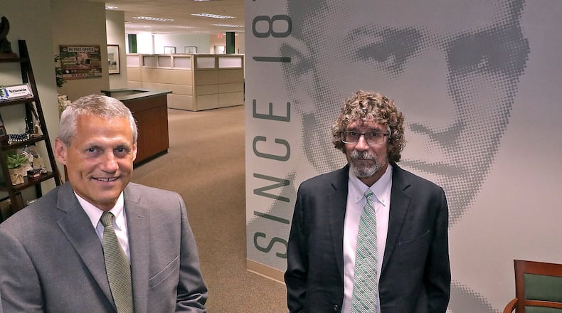 P.J. Miller, left, and Patrick Field co-owners of Wallace & Turner, Inc., in their Springfield office Tuesday. Wallace & Turner, Inc. is celebrating 150 years in the insurance industry. BILL LACKEY/STAFF