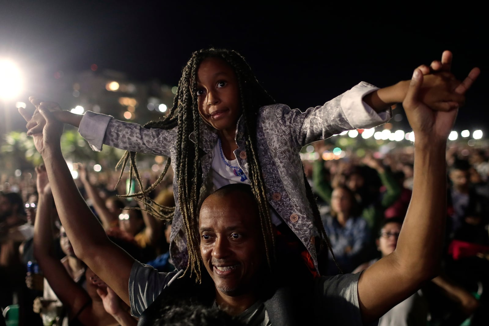 Fans cheer as they watch Lady Gaga free concert on Copacabana beach, in Rio de Janeiro, Saturday, May 3, 2025. (AP Photo/Bruna Prado)