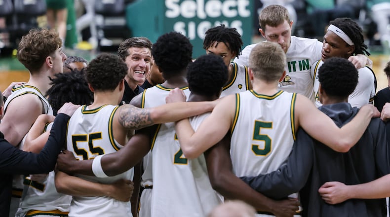 Wright State coach Clint Sargent (center left) talks to players during a huddle before the start of the second half of a Horizon League Championship first-round game against Cleveland State on Wednesday, March 4 at Ervin J. Nutter Center in Fairborn. BRYANT BILLING / STAFF