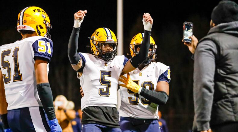 Springfield High School senior Aaron Scott celebrates after scoring a touchdown during their game against Olentangy on Friday night at Hilliard Darby High School. The Wildcats won 37-24. Michael Cooper/CONTRIBUTED