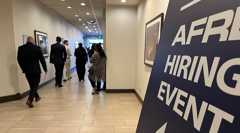 Applicants walk to the Air Force Research Laboratory hiring event last October at the Fairborn Holiday Inn. THOMAS GNAU/STAFF