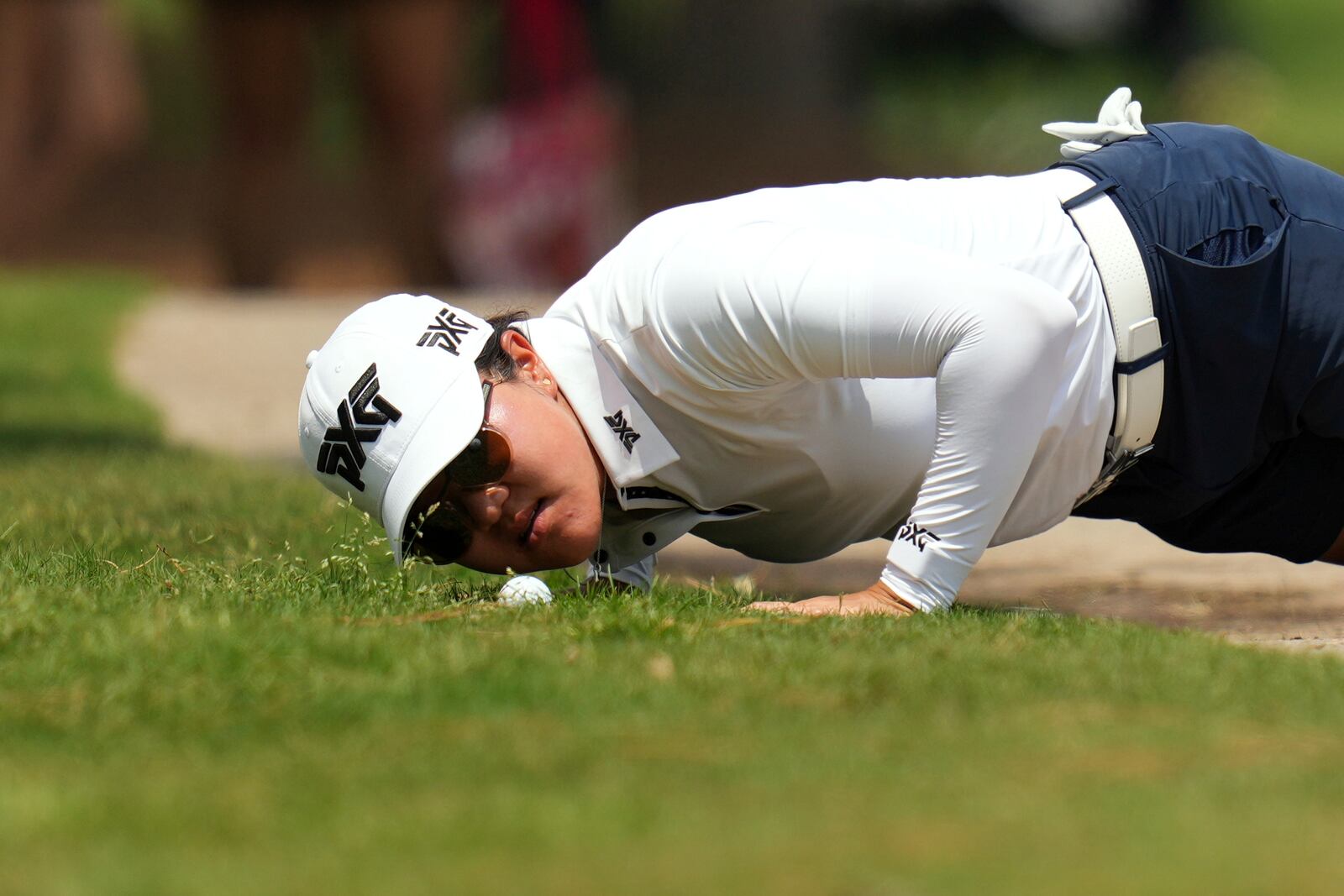 Auston Kim looks at her ball on the tenth hole during the second round of the Chevron Championship LPGA golf tournament Friday, April 25, 2025, in The Woodlands, Texas. (AP Photo/Eric Gay)