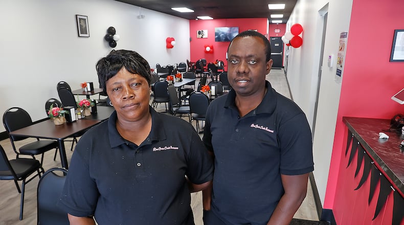 Rosene Roman, the owner of Rose Goute Creole Restaurant at 1881 S. Limestone St. in Springfield, and her manager Romane Pierre stand inside the restaurant featuring Haitian cuisine Tuesday, Aug. 1, 2023. BILL LACKEY/STAFF