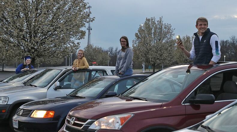 Springfield seniors join in as the high school stadium lit up on Monday night to honor the class of 2020. BILL LACKEY/STAFF
