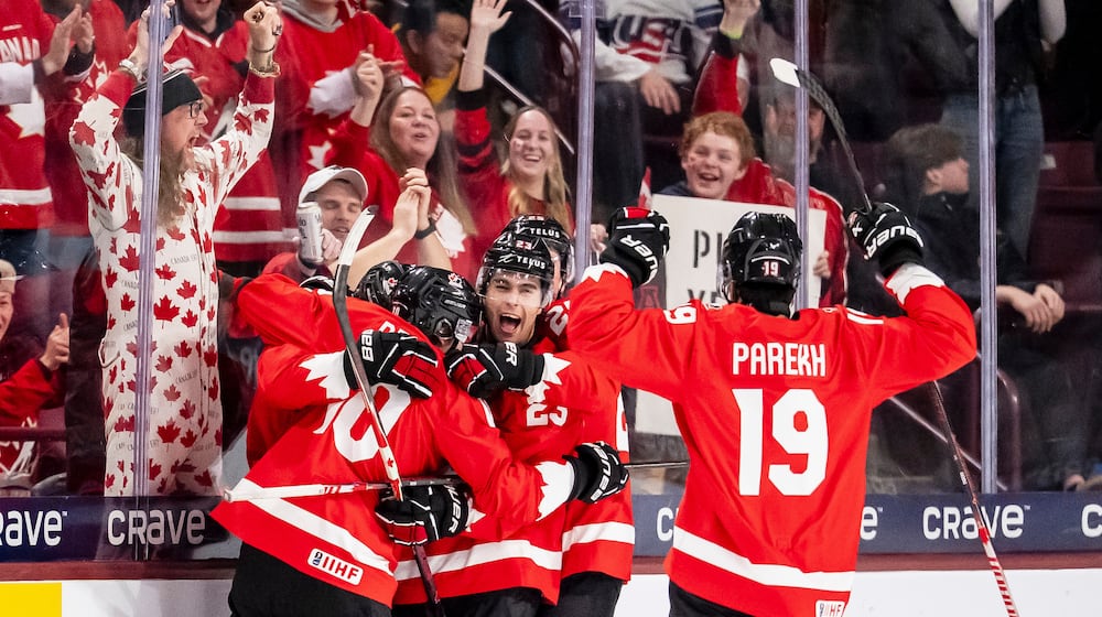 Canada's Cole Beaudoin (26) celebrates his goal with teammates after scoring in second period IIHF World Junior Championship hockey action against Finland in Minneapolis on Wednesday, Dec. 31, 2025. (Christopher Katsarov/The Canadian Press via AP)