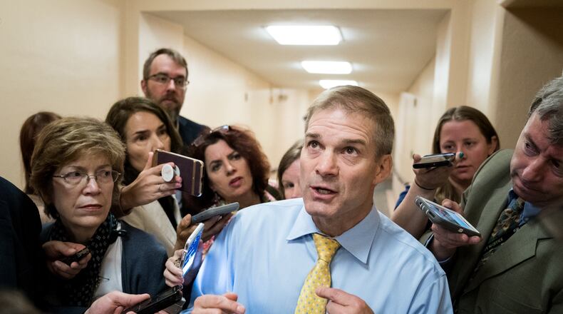 Rep. Jim Jordan (R-Ohio) is questioned by reporters in a Capitol Hill hallway, in Washington, June 26, 2018. Jordan is facing a slowly-percolating sexual misconduct scandal, as new accusers step forward by the day to say the wrestling coach-turned-politician was aware of allegations that an Ohio State University doctor fondled multiple students, but did nothing to stop it. (Erin Schaff/The New York Times)