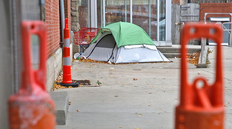 A tent is pitched along the north side of the Clark County Heritage Center Monday, Nov. 27, 2023 for a homeless person trying to find shelter from the cold. BILL LACKEY/STAFF