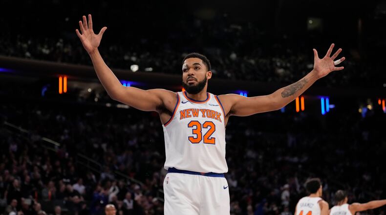 New York Knicks center Karl-Anthony Towns (32) reacts during the first half of an NBA basketball game against the Denver Nuggets, Wednesday, Feb. 4, 2026, in New York. (AP Photo/Yuki Iwamura)