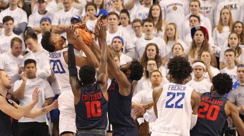 Jalen Johnson, of Saint Louis, shoots against Dayton’s Jalen Crutcher and Josh Cunningham on Saturday, Jan. 27, 2018, at Chaifetz Arena in St. Louis, Mo. David Jablonski/Staff