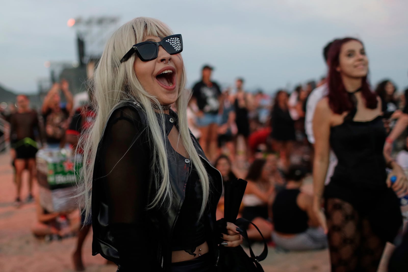 A fan waits for the start of Lady Gaga's free concert on Copacabana beach in Rio de Janeiro, Saturday, May 3, 2025. (AP Photo/Bruna Prado)