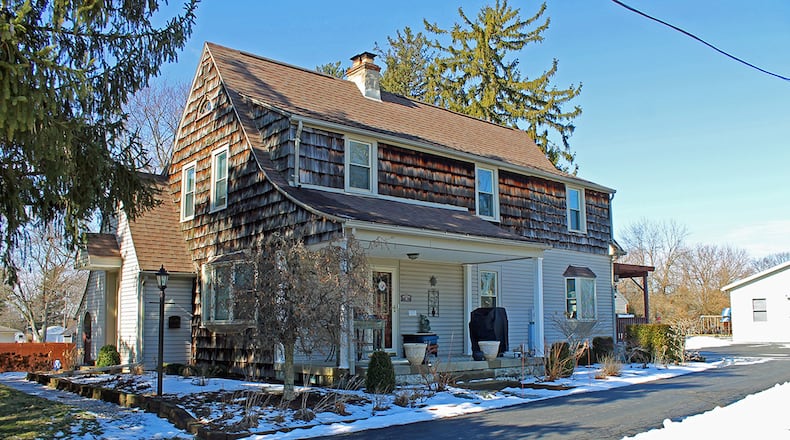 This 4-bedroom home with about 2,480 sq. ft. of living space sits on 2 acres. The property has a detached, 2-car garage and pole building. CONTRIBUTED PHOTO BY VICKIE KAPNAS
